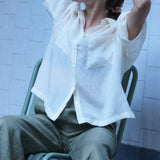 Silk textured oversized blouse with collar and pockets