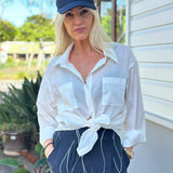 White Cotton  long sleeved Shirt with front pockets.