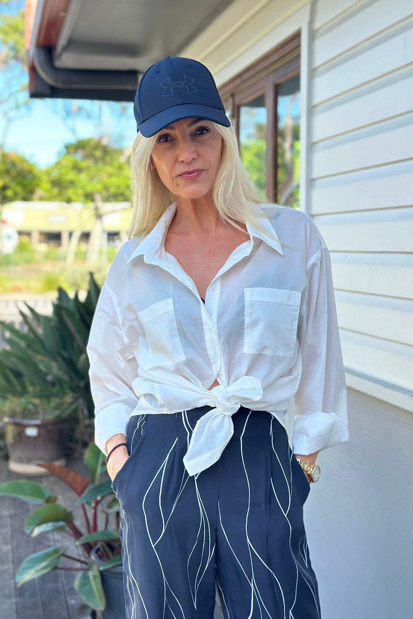 White Cotton  long sleeved Shirt with front pockets.