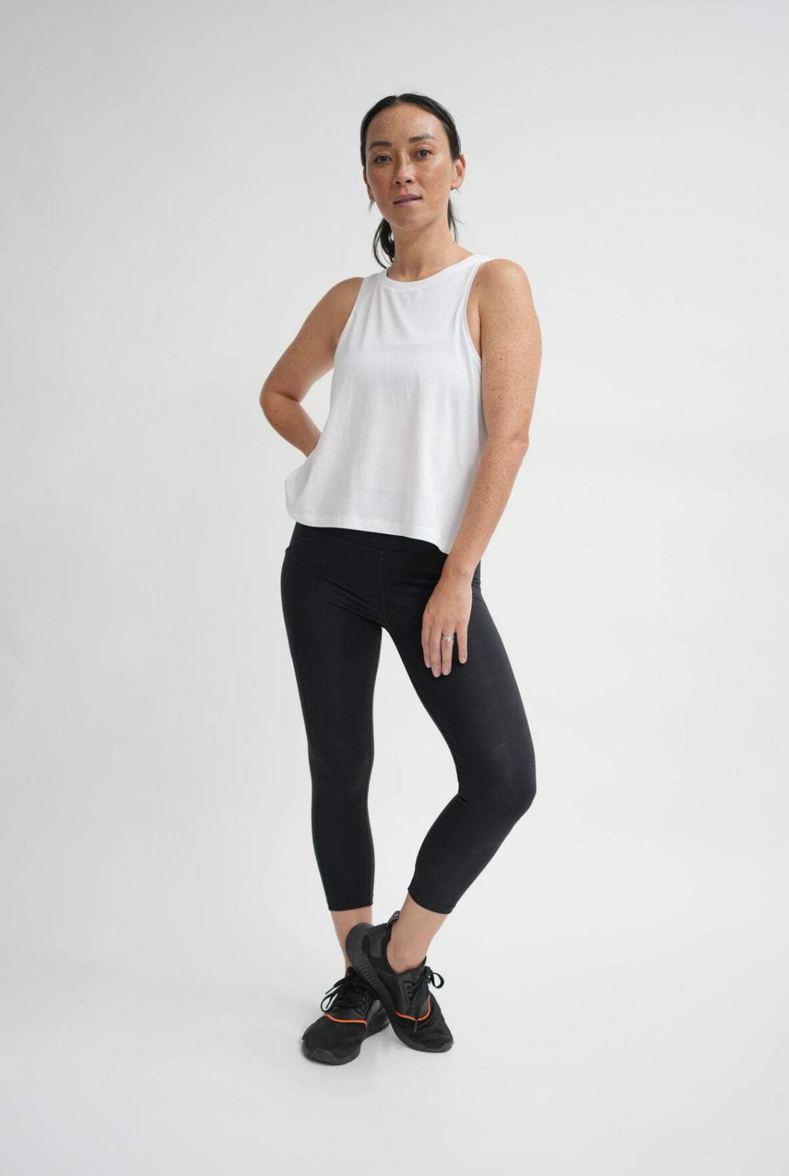Organic cotton white singlet with cut in arms and swing hem