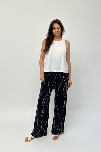 Silk pants with high waist, wide leg and pockets. 