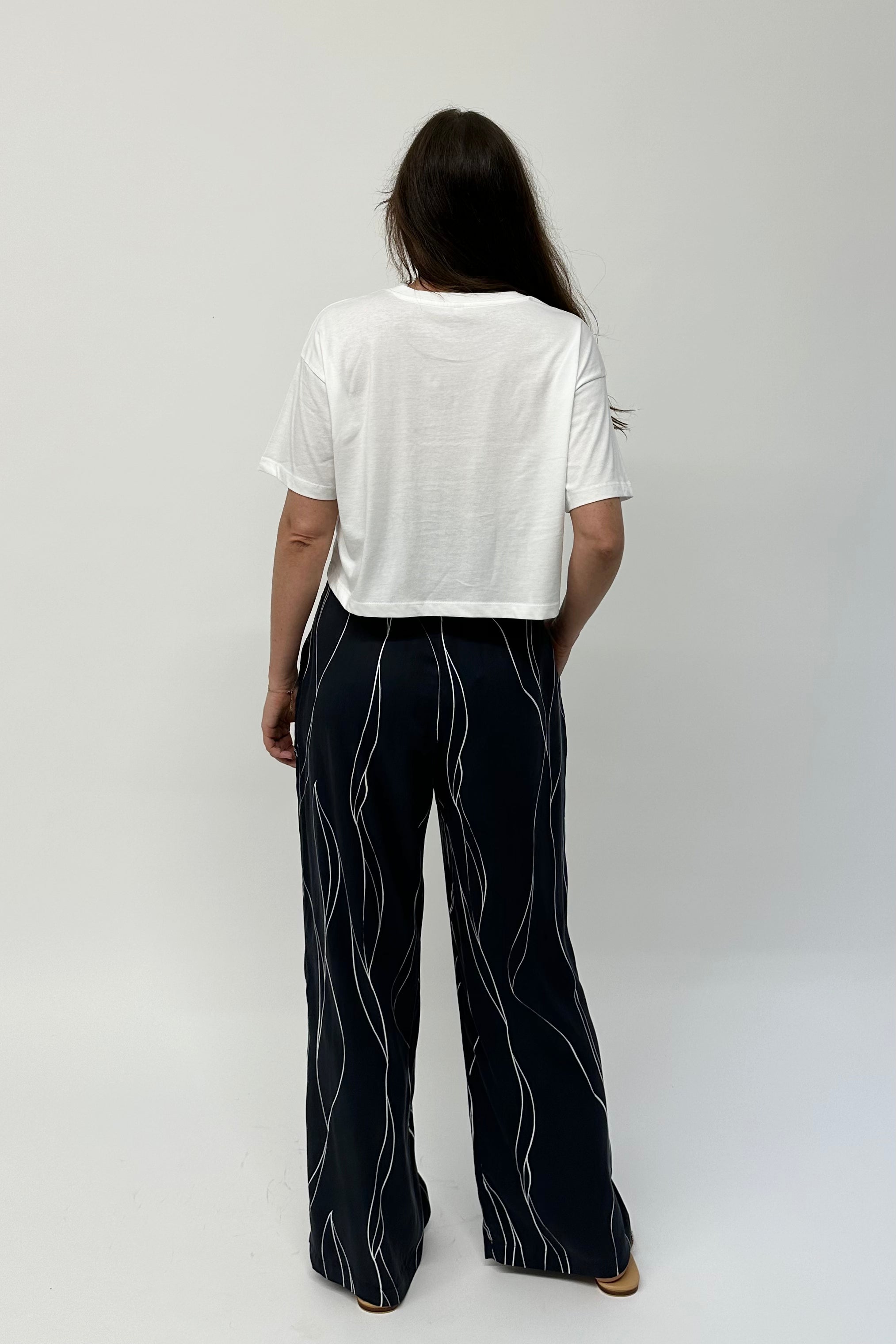 Wide legged silk pants with pockets.