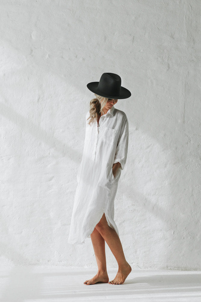 White linen dress midi length.